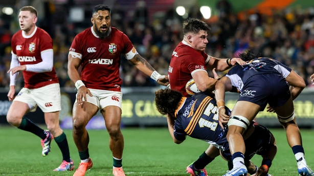 9 July 2025; Dan Sheehan of British & Irish Lions is tackled by ACT Brumbies players Ollie Sapsford, left, and Tuaina Taii Tualima during the tour match between ACT Brumbies and the British & Irish Lions at GIO Stadium in Canberra, Australia. Photo by Steve Christo/Sportsfile