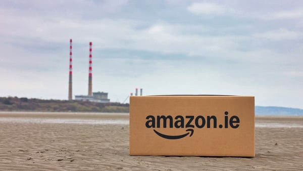 Amazon box on Sandymount Strand in front of Poolbeg Chimneys in Dublin