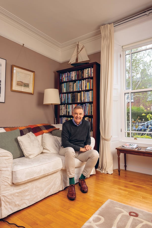 Bryan Dobson sitting on a couch