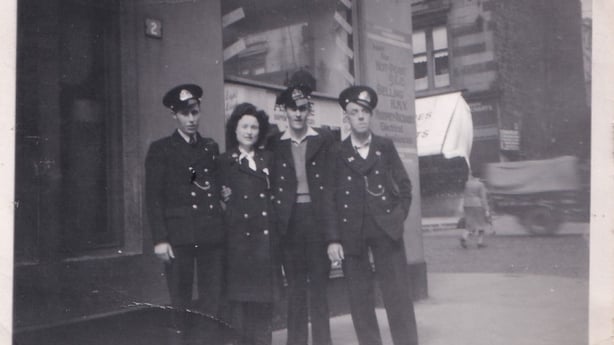 Three man and woman posing for a picture