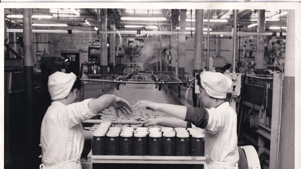 Two women working in a factory
