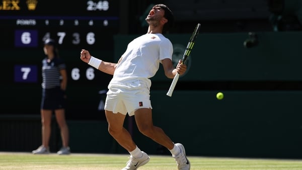 Carlos Alcaraz of Spain celebrates winning match point against Taylor Fritz of United States during the Gentlemen's Singles semi-final match on day eleven of The Championships Wimbledon 2025 at All England Lawn Tennis and Croquet Club on July 11, 2025 in