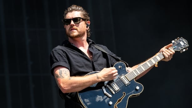 a person playing a guitar