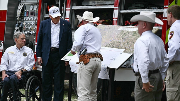 US President Donald Trump and Texas Governor Greg Abbott (L) meet 