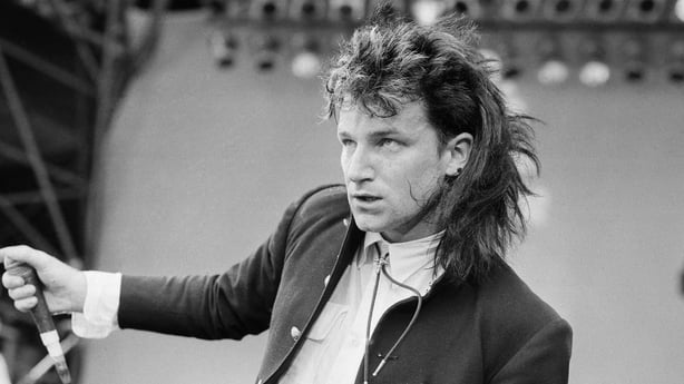 Bono (real name Paul David Hewson) performs with his band U2 at Live Aid, Wembley Stadium, London, and event to raise money to ease the famine in Ethiopia. U2 performed two songs on the day, Sunday Bloody Sunday and Bad. Picture taken 13th July 1985 (Photo by Staff/Mirrorpix via Getty Images)