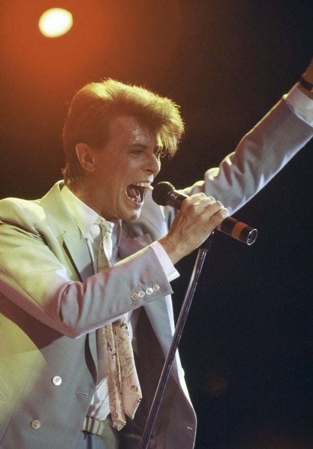 David Bowie sings during the Live Aid concert held in London. The 1985 concert was held simultaneously at JFK Stadium in Philadelphia and at Wembley Stadium in London, and raised over $70 million for Ethiopian famine relief. (Photo by Jacques Langevin/Sygma/Sygma via Getty Images)