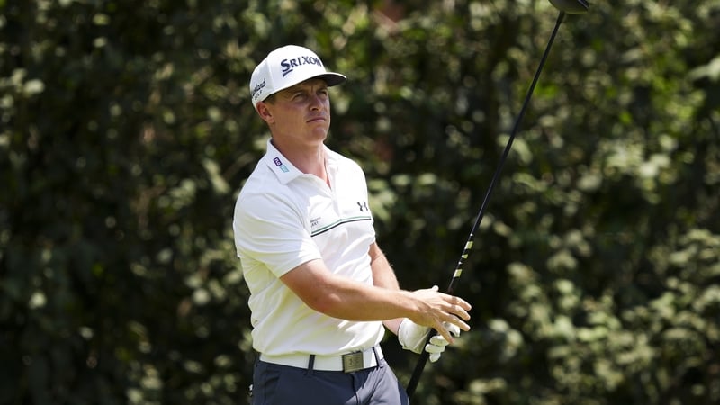 Conor Purcell watches a tee shot on the second hole