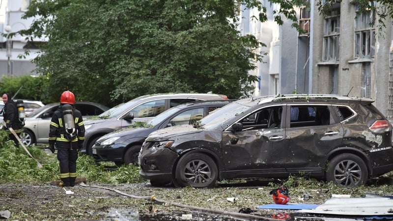 Emergency teams are seen following Russia's attack on the Ukrainian city of Liviv