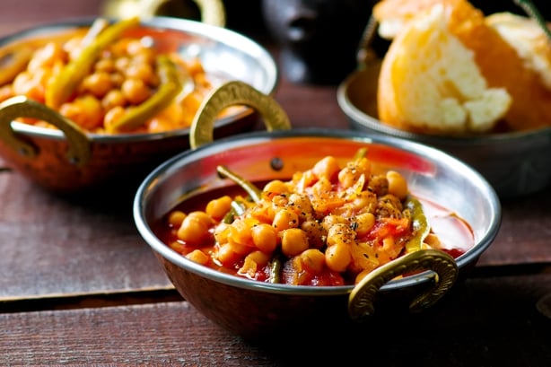 chick-pea stewed with haricot and a tomato on Lebanese in a copper vintage bowl. selective focus