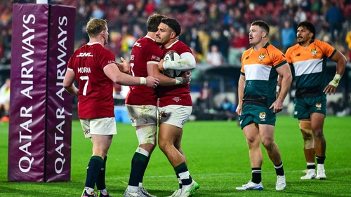 Sione Tuipulotu of British & Irish Lions celebrates with teammates Jac Morgan Huw Jones after scoring their side's third try