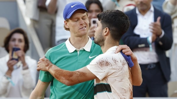 PARIS, FRANCE - JUNE 9: Carlos Alcaraz of Spain (R) salutes Jannik Sinner of Italy at the net after his victory in the men's final on day 15 of the 2025 French Open, Roland-Garros 2025, Grand Slam tennis tournament at Roland Garros stadium on June 8, 2025