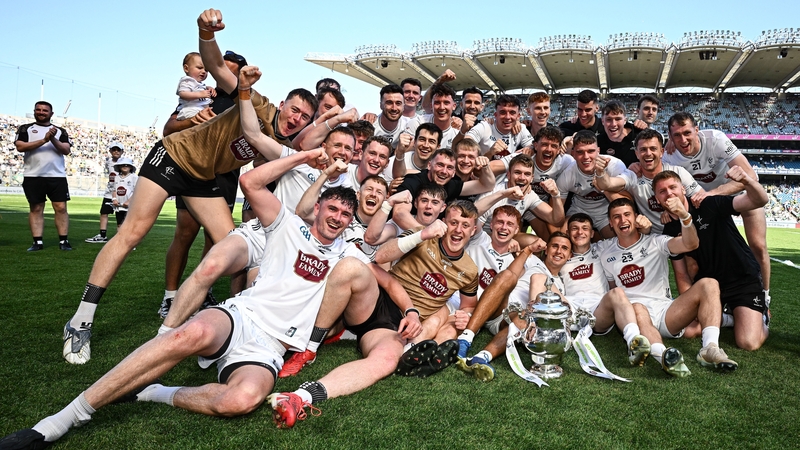 Kildare players and staff celebrate after their side's victory in the Tailteann Cup final