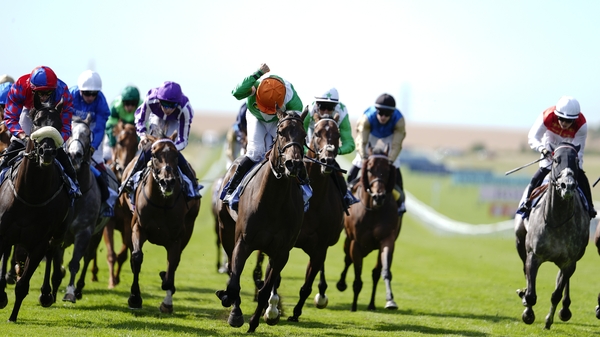 NEWMARKET, ENGLAND - JULY 12: Neil Callan riding No Half Measures (orange cap) win The Al Basti Equiworld, Dubai July Cup Stakes at Newmarket Racecourse on July 12, 2025 in Newmarket, England. (Photo by Alan Crowhurst/Getty Images)
