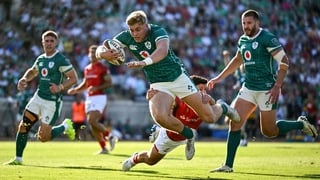 12 July 2025; Hugh Gavin of Ireland on his way to scoring his side's second try despite the tackle from Simao Bento of Portugal during the International Rugby Test match between Portugal and Ireland at Estádio Nacional do Jamor in Lisbon, Portugal. Photo