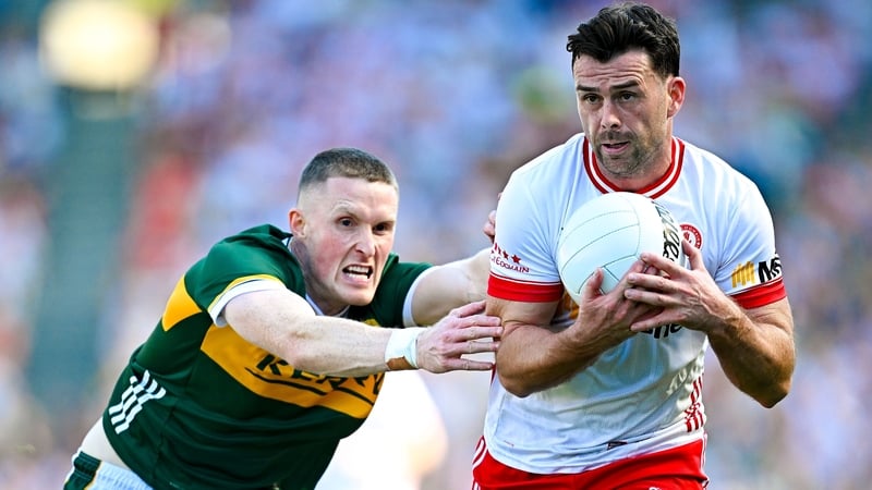 Jason Foley doggedly pursues Tyrone's Darren McCurry at Croke Park