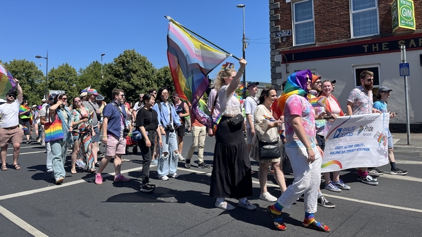 People march with pride flags and rainbow paraphernalia at the annual Limerick pride parade