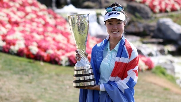 a person holding a trophy