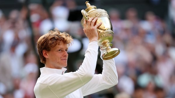 LONDON, ENGLAND - JULY 13: Jannik Sinner of Italy lifts the Gentlemen’s Singles Trophy following his victory against Carlos Alcaraz of Spain during the Gentlemen’s Singles Final on day fourteen of The Championships Wimbledon 2025 at All England Lawn Tenni