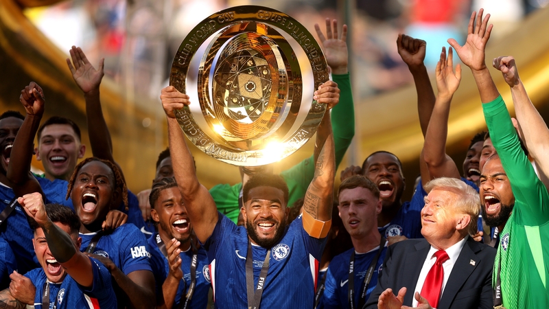 President Donald Trump watches on as Reece James lifts the Club World Cup trophy