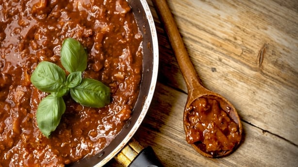 Spaghetti Bolognaise Sauce in the Pot on the wooden table