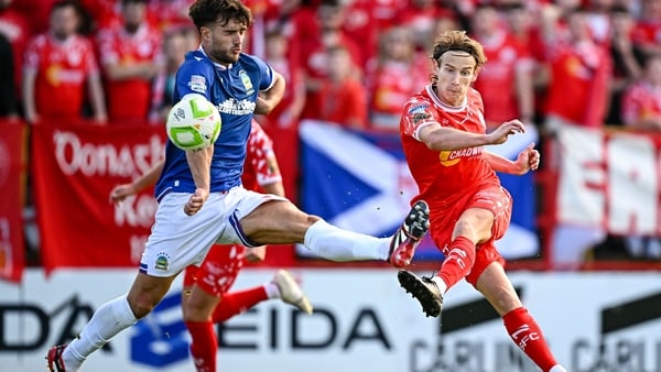 Harry Wood of Shelbourne in action against Euan East of Linfield during the UEFA Champions League First Qualifying Round first leg match between Shelbourne and Linfield at Tolka Park in Dublin.
