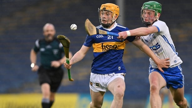 3 May 2022; Darragh McCarthy of Tipperary is tackled by Darragh Walsh of Waterford during the Electric Ireland Munster GAA Minor Hurling Championship Semi-Final match between Tipperary and Waterford at FBD Semple Stadium in Thurles, Tipperary. Photo by Brendan Moran/Sportsfile