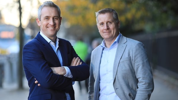 Richard Guy and John Gilleran, co-CEOs of Konversational, pose for photos in casual suits