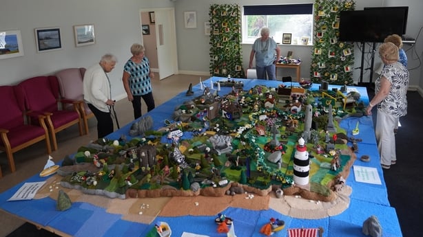 Some of the knitters in Carnew Community Care centre in Carnew Co. Wicklow, with their knitted Map of Ireland