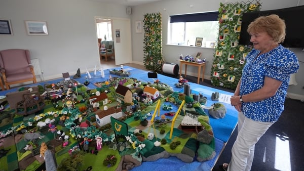 Mary Blake with her group's knitted map of Ireland in Carnew Community Care centre in Carnew Co. Wicklow