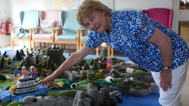 Mary Blake points to a boat in memory of Margaret Dowse who passed away during the creation of her group's knitted map of Ireland in Carnew Community Care centre in Carnew Co. Wicklow