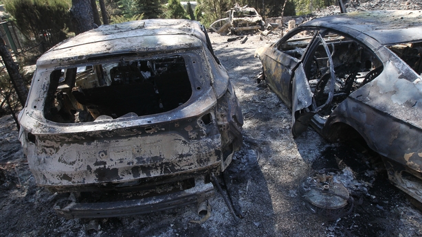 a group of burnt cars