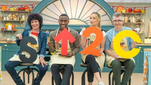 a group of people holding up letters