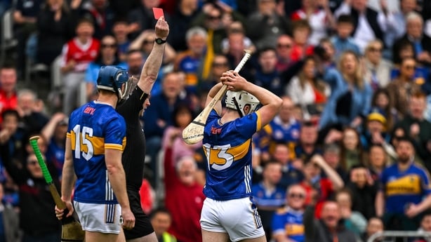 27 April 2025; Darragh McCarthy of Tipperary, 13, is shown a red card by referee Johnny Murphy during the Munster GAA Hurling Senior Championship Round 2 match between Cork and Tipperary at SuperValu Páirc Uí Chaoimh in Cork. Photo by Brendan Moran/Sportsfile