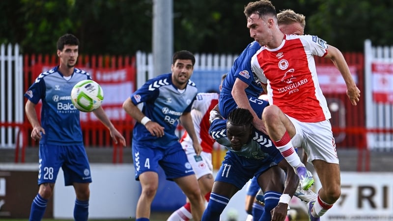 Mason Melia has a shot on goal despite the efforts of Hegelmann striker Kader Njoya Abdel in the first leg