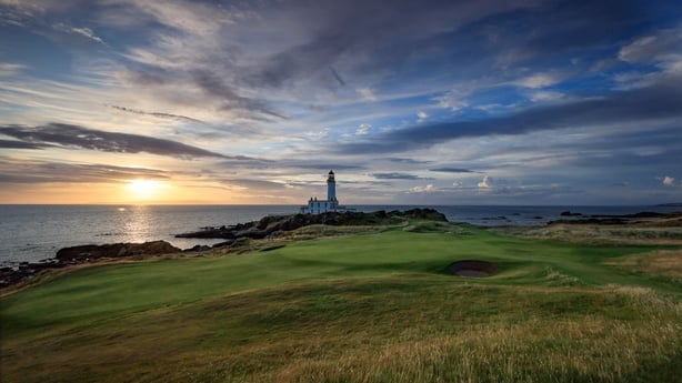 GIRVAN, SCOTLAND - JULY 09: A view of the green on the par 3, ninth hole beside The Turnberry Lighthouse as sunset on the Ailsa golf course at Trump Turnberry resort on July 09, 2023 in Girvan, Scotland. (Photo by David Cannon/Getty Images)