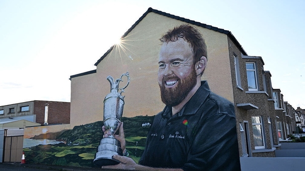 Mural showing 2019 Open winner Ireland's Shane Lowry holding the claret jug on the side of a house 