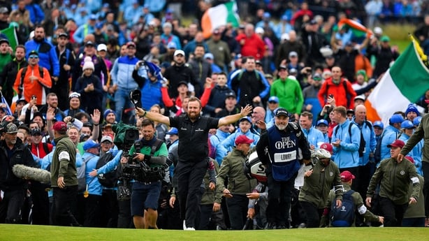 Shane Lowry of Ireland celebrates as he walks onto the 18th green on his way to winning The Open Championship on Day Four of the 148th Open Championship at Royal Portrush in Portrush, Co Antrim.