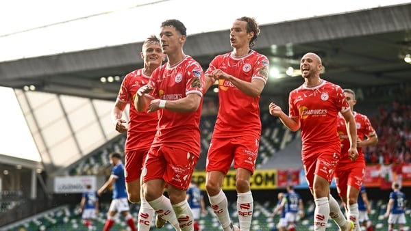 16 July 2025; Ali Coote of Shelbourne celebrates with teammates JJ Lunney and Harry Wood after scoring his side's first goal during the UEFA Champions League First Qualifying Round second leg match between Linfield and Shelbourne at Clearer Twist National