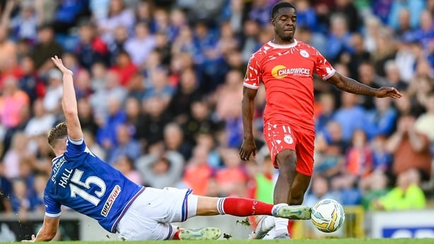 16 July 2025; Ben Hall of Linfield tackles Mipo Odubeko of Shelbourne, resulting in a red card, during the UEFA Champions League First Qualifying Round second leg match between Linfield and Shelbourne at Clearer Twist National Football Stadium at Windsor Park in Belfast. Photo by Stephen McCarthy/Sp