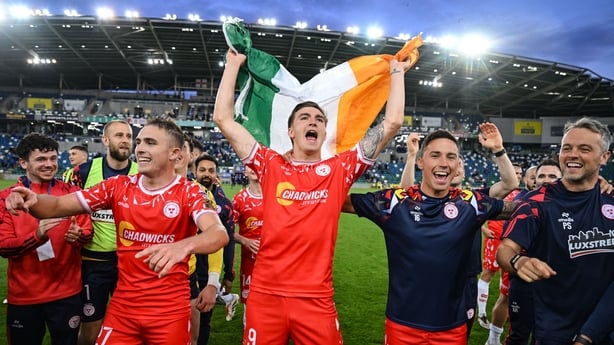 16 July 2025; Sean Boyd of Shelbourne, centre, and teammates after their side's victory in the UEFA Champions League First Qualifying Round second leg match between Linfield and Shelbourne at Clearer Twist National Football Stadium at Windsor Park in Belfast. Photo by Stephen McCarthy/Sportsfile