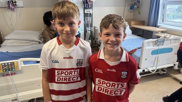 Cork supporters Shane and Joey Holland are pictured on the Puffin Ward at Cork University Hospital