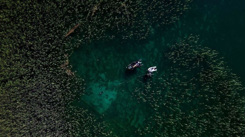 Aerial photograph taken on 27 July 2023, shows a diver searching for archaeological material in Lake Ohrid, Albania