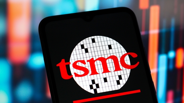 a close up of a mobile phone with the TSMC logo on it