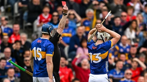 Darragh McCarthy of Tipperary, 13, is shown a red card by referee Johnny Murphy during the Munster GAA Hurling Senior Championship Round 2 match between Cork and Tipperary at SuperValu Páirc Uí Chaoimh in Cork.