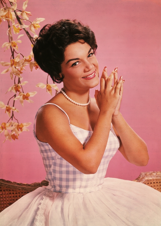 Studio portrait of American singer Connie Francis wearing a lavender and white spaghetti-strap dress. (Photo by Archive Photos/Getty Images)
