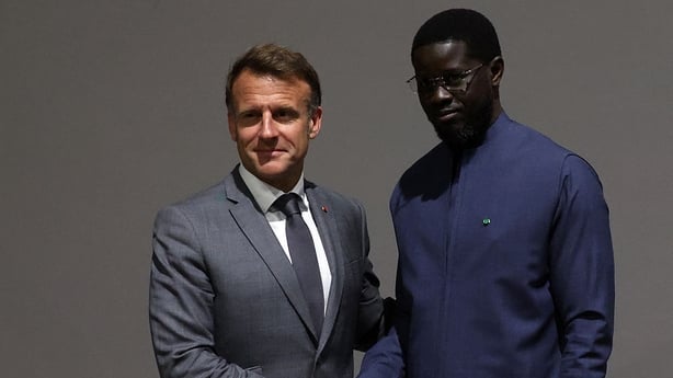 France's President Emmanuel Macron and Senegal's Prsident Bassirou Diomaye Faye shake hands during a meeting held in the framework of the United Nations 4th International Conference on Financing and Development in Seville, Spain, on June 30, 2025. A UN conference aiming to rally fresh support for de
