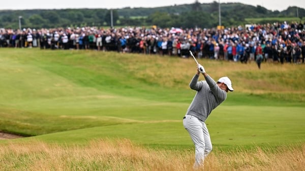 17 July 2025; Rory McIlroy of Northern Ireland plays a shot from the rough on the first hole during day one of The 153rd Open Championship at Royal Portrush Golf Club in Portrush, Antrim. Photo by Ramsey Cardy/Sportsfile
