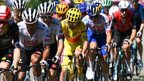 a group of people riding bicycles