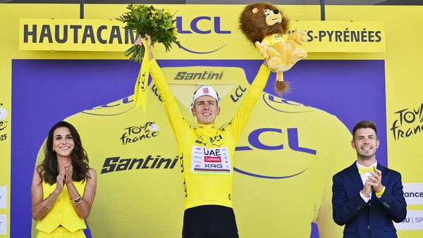 Slovenian Tadej Pogacar of UAE Team Emirates celebrates on the podium in the yellow jersey of leader in the overall ranking after stage 12 of the 2025 Tour de France cycling, from Auch to Hautacam (181 km), on Thursday 17 July 2025 in France. The 112th ed