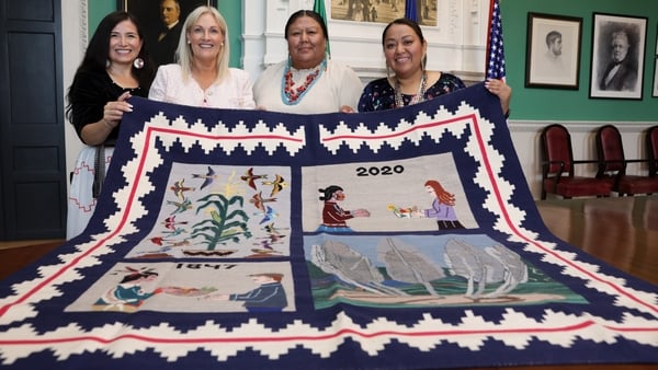 Ceann Comhairle Verona Murphy receives a handwoven rug gifted to the people of Ireland as a thank you from two Native American nations